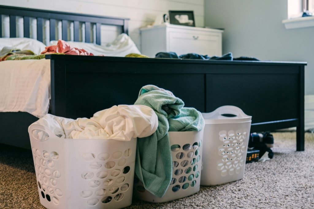 signs aging parents need help: unfolded laundry